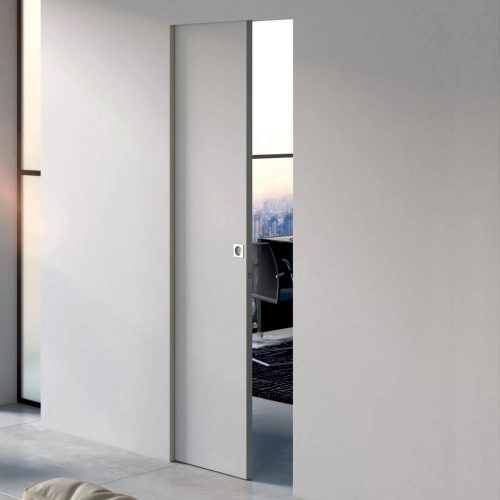 Puerta corredera rasomuro Scrigno Openbox integrada en la pared, con diseño minimalista sin marcos visibles que permite una apertura discreta y un acabado limpio y moderno.