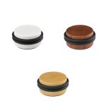 Topes de puerta Inofix 2092 con fijación adhesiva, disponibles en acabados blanco, madera oscura y madera natural, con anillo de caucho amortiguador